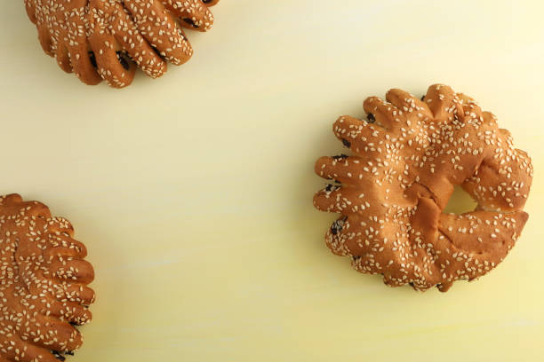 istock Bakery - gold rustic crusty loaves of bread and buns on textured background. 1162512998