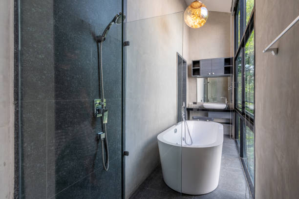 istock loft Luxury bathroom features bathtub with flower 1162513122