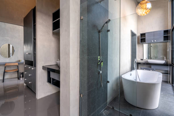 istock loft Luxury bathroom features bathtub with flower 1162513123