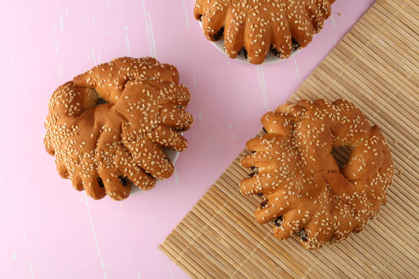 istock Bakery - gold rustic crusty loaves of bread and buns on textured background. 1162513193