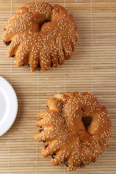 istock Bakery - gold rustic crusty loaves of bread and buns on textured background. 1162513705