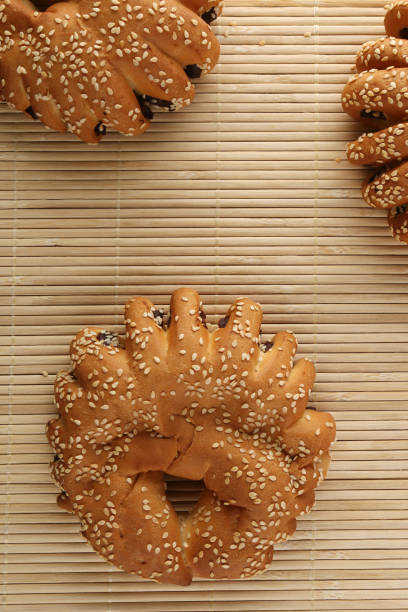 istock Bakery - gold rustic crusty loaves of bread and buns on textured background. 1162513768