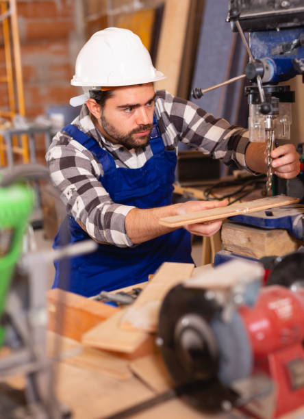 istock Portrait of worker who works on drilling machine 1162513782