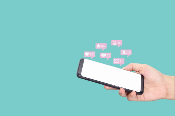 people using mobile smartphone with blank white screen for social media interactions with notification icons from friend in social network with like, message, email, mention and star above smartphone