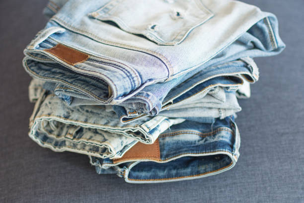 istock Pile of different blue jeans. 1162514184