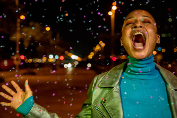 istock Cool woman under a rain of confetti 1162516377
