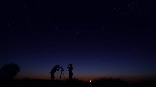 Young people observing the night sky