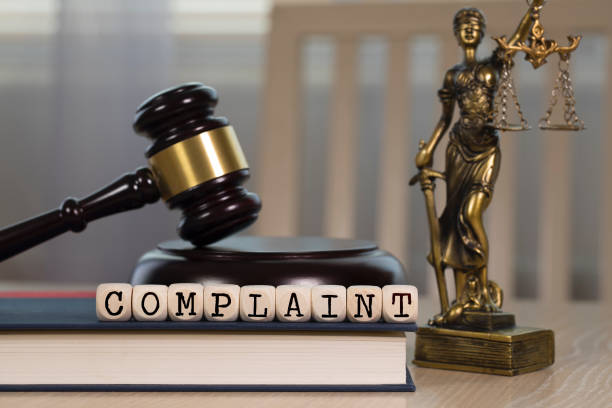 istock Word COMPLAINT composed of wooden dices. 1162518373
