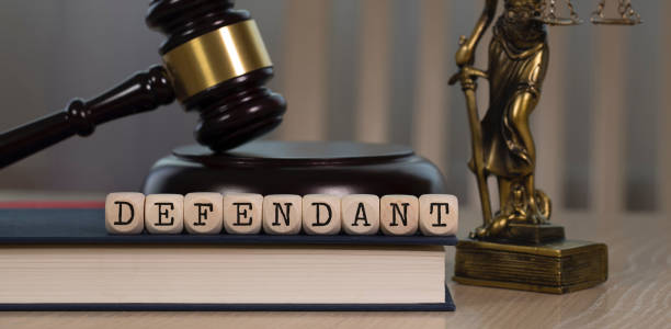 istock Word DEFENDANT composed of wooden dices. 1162518599