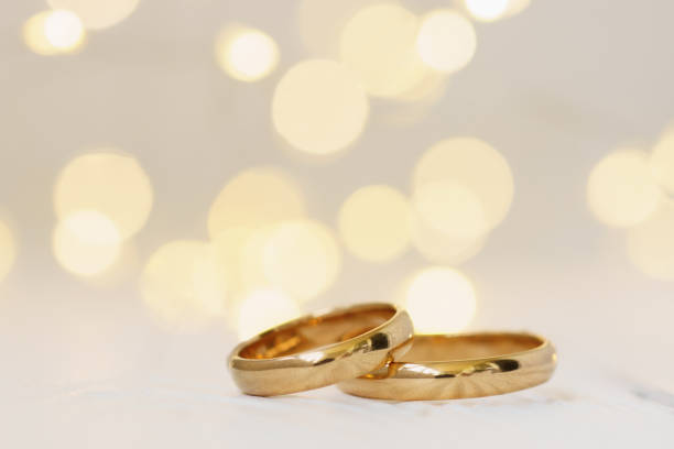 istock Wedding background with two golden rings. 1162520065