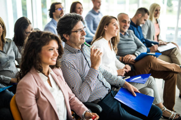 istock Happy business people on a training class in the office. 1162522881