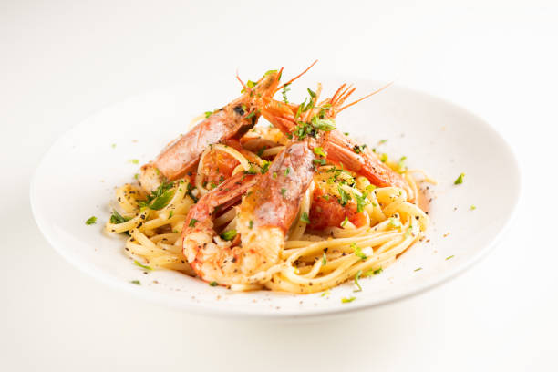 istock Linguine with garlic and king prawns on a plate 1162523098