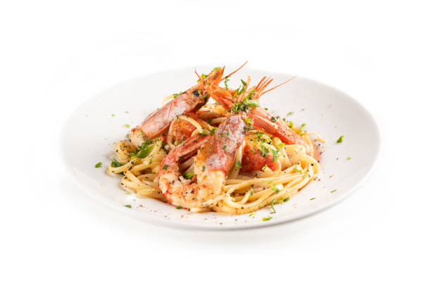 istock Linguine with garlic and king prawns on a plate 1162523120