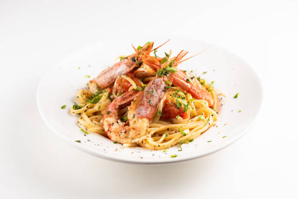 istock Linguine with garlic and king prawns on a plate 1162523147