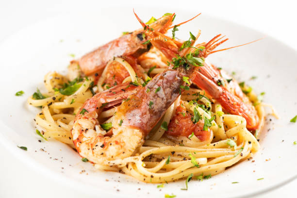 istock Linguine with garlic and king prawns on a plate 1162523165