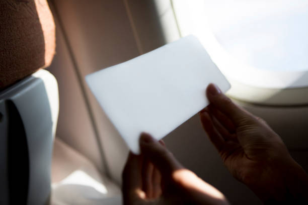 istock Woman holding airplane ticket in the plane 1162523477