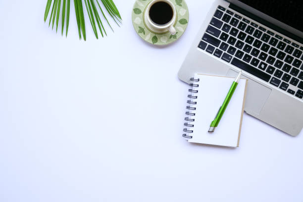 istock View of office desk with laptop and notepad 1162524416