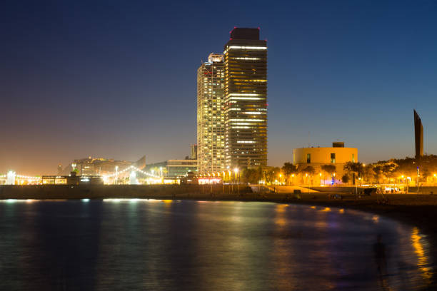 istock Barceloneta beach with skyscrapers in night 1162524926