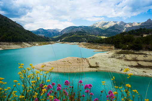 scenic landmark with Guadalest water storage with turquoise water located in valley