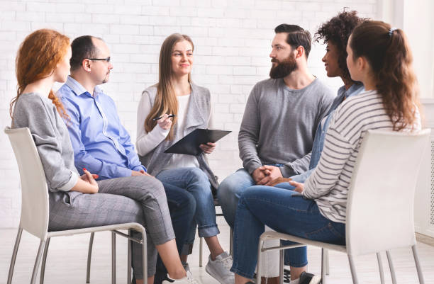 istock Specialist talking to newcomers on therapy session 1162526157