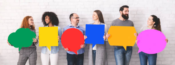 istock Cheerful diverse people holding empty colorful speech bubbles 1162526285