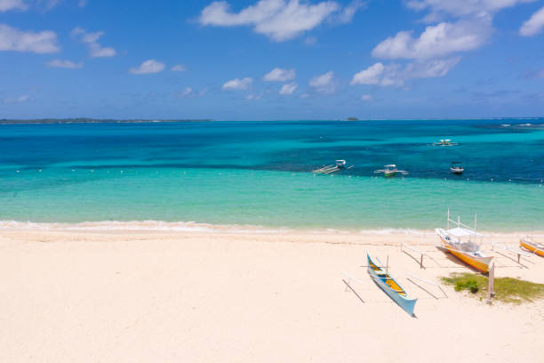 istock White sandy beach with boats. White beach with turquoise lagoon 1162529273