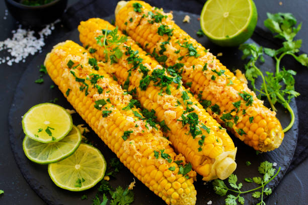 istock Boiled corn with mexican spices, butter, cilantro. 1162529749
