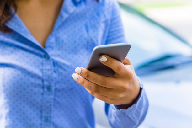 istock Woman Using a Smart Phone in the City Streets 1162531615