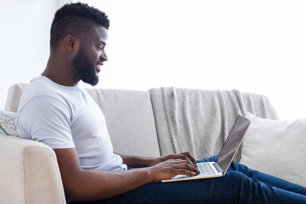 istock Millennial black man working on laptop in home office 1162532129