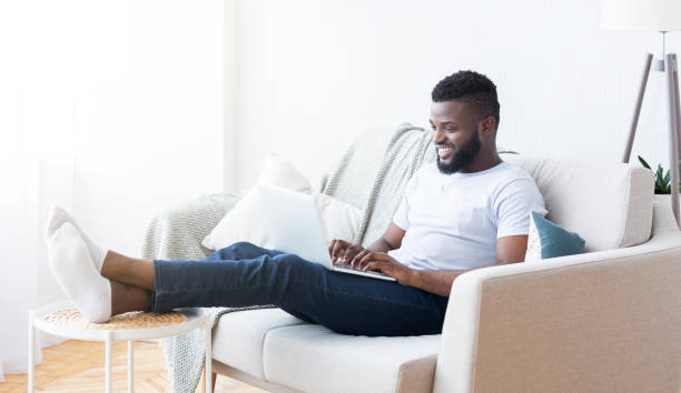 istock Smiling african-american guy studying foreign language online 1162532203