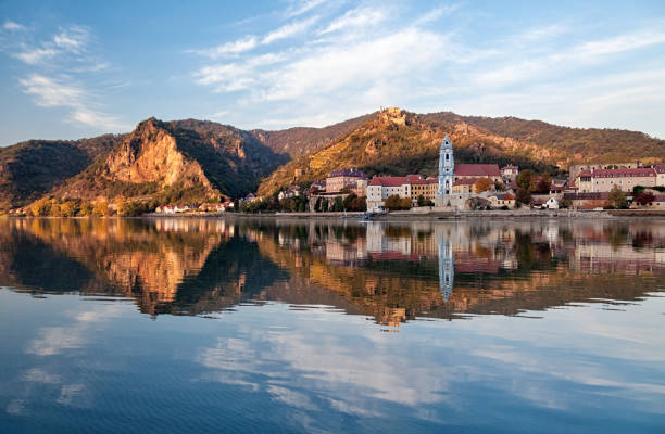 Autumn evening view of Durnstein old town with reflection in Danube, Wachau valley, Austria Durnstein vineyards, Wachau valley, Austria durnstein stock pictures, royalty-free photos & images