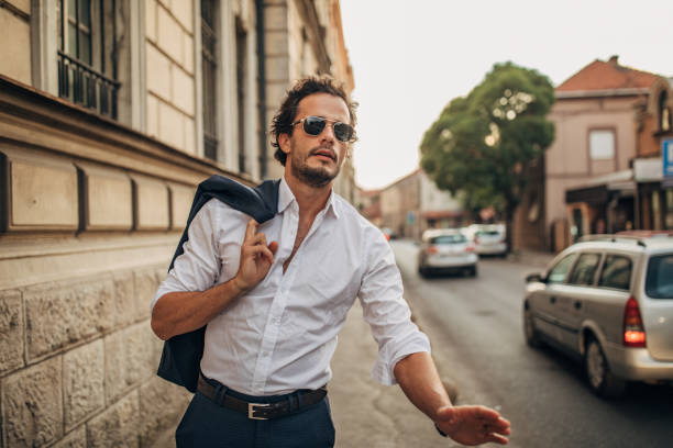 istock Gentleman standing on the sidewalk 1162533011