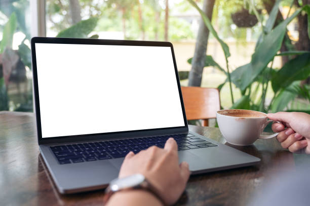 istock a woman using and touching laptop touchpad with blank white desktop screen 1162533068