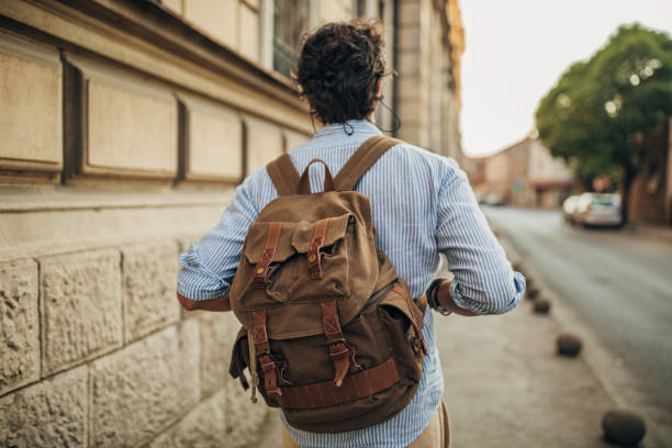 istock Tourist with backpack on the street 1162534358