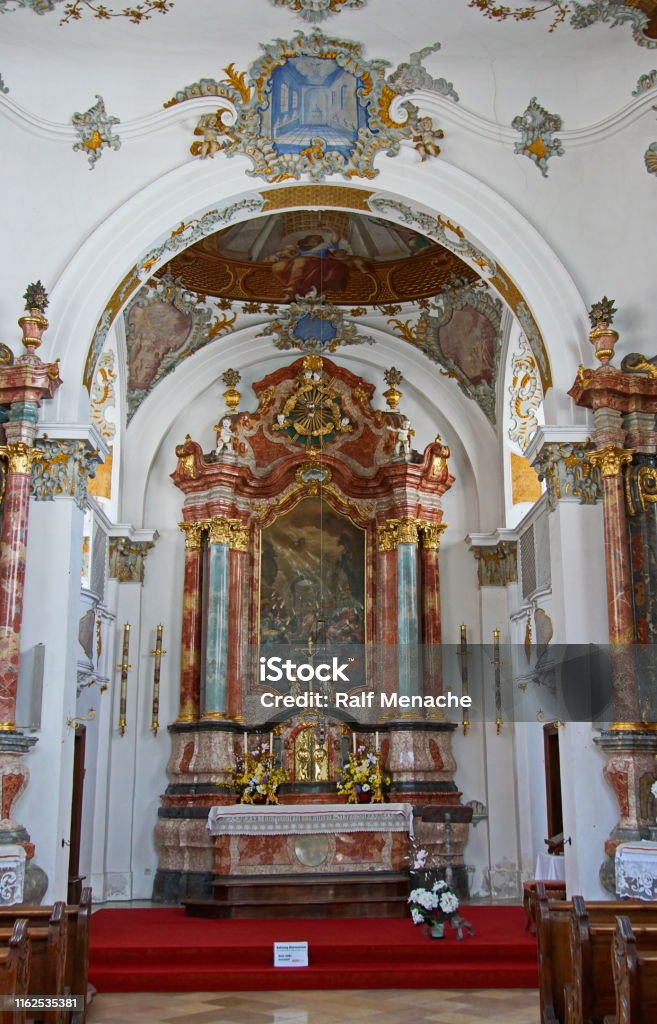 The altar of the Holy Spirit Church (Heilig Geist Spitalkirche) in the historic old town of Füssen. Allgäu, Bavaria - Germany. Neuschwanstein Castle Stock Photo