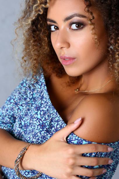 istock Pretty female with curly brown hair 1162536160
