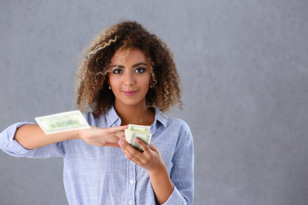istock Rich pretty woman with cash 1162536180
