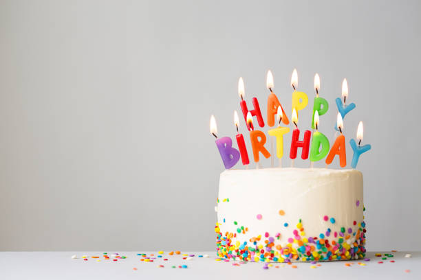 istock Birthday cake with colorful candles 1162537896
