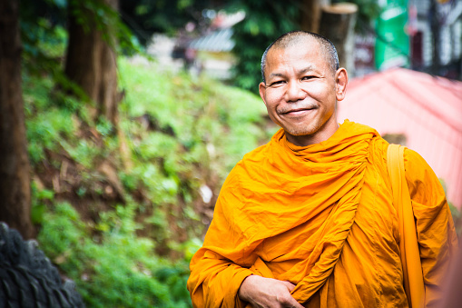 Portrait of buddhist monk in thailand wandering