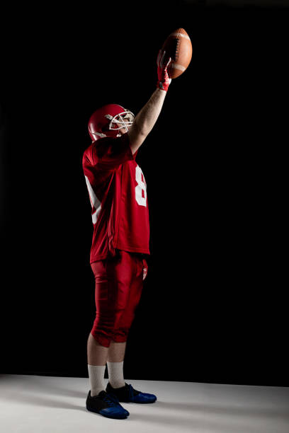 istock American football player cheering with arm up 1162542683