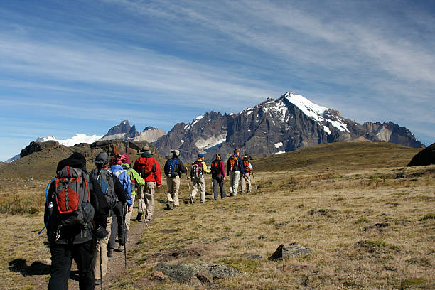 Hikers trekking in mountains in Patagonia stock photo