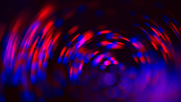 neon azul vermelho roxo círculo bokeh preto fundo abstrato borrão movimento colorido faíscas - spiral shape red shiny - fotografias e filmes do acervo