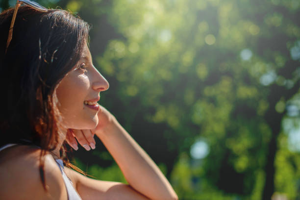 istock Smiling Young woman in the Park 1162545702