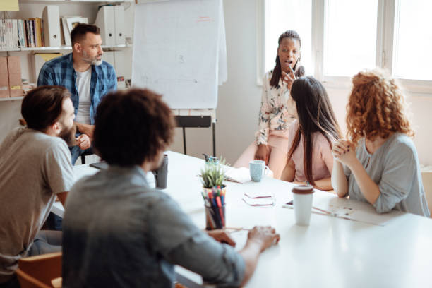istock Multi ethnic group of professionals at a meeting 1162546766