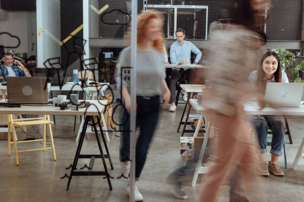 istock Multi ethnic group of professionals at a coworking office 1162547400