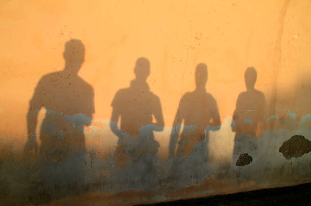 istock Shadow of four friends/brothers 1162547516
