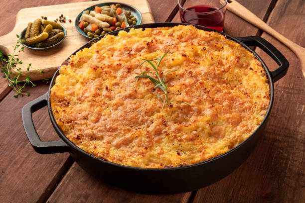 istock Shepherd's pie with pickles and red wine on a rustic wooden background 1162548817