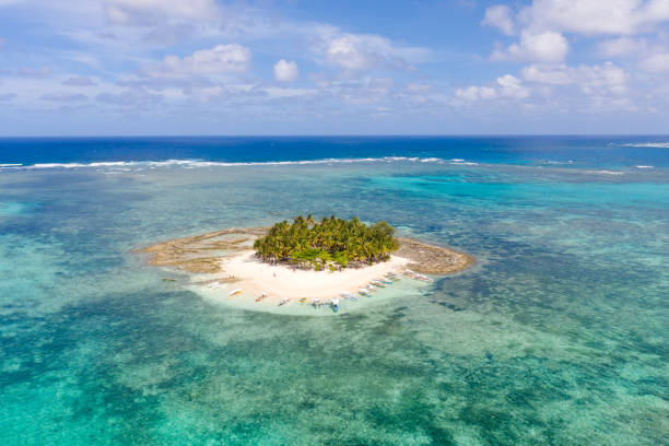 istock Guyam island, Siargao, Philippines. Small island with palm trees and a white sandy beach 1162551766