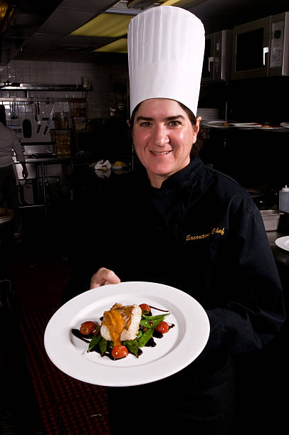 istock Proud Female chef showing a fish dish 116255195