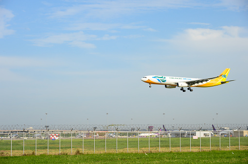 Cebu Pacific Air RP-C3344 Airbus plane landing to runways at suvarnabhumi international airport in Bangkok ,Thailand. This airport is one of the most populated airports in the world. with copy space